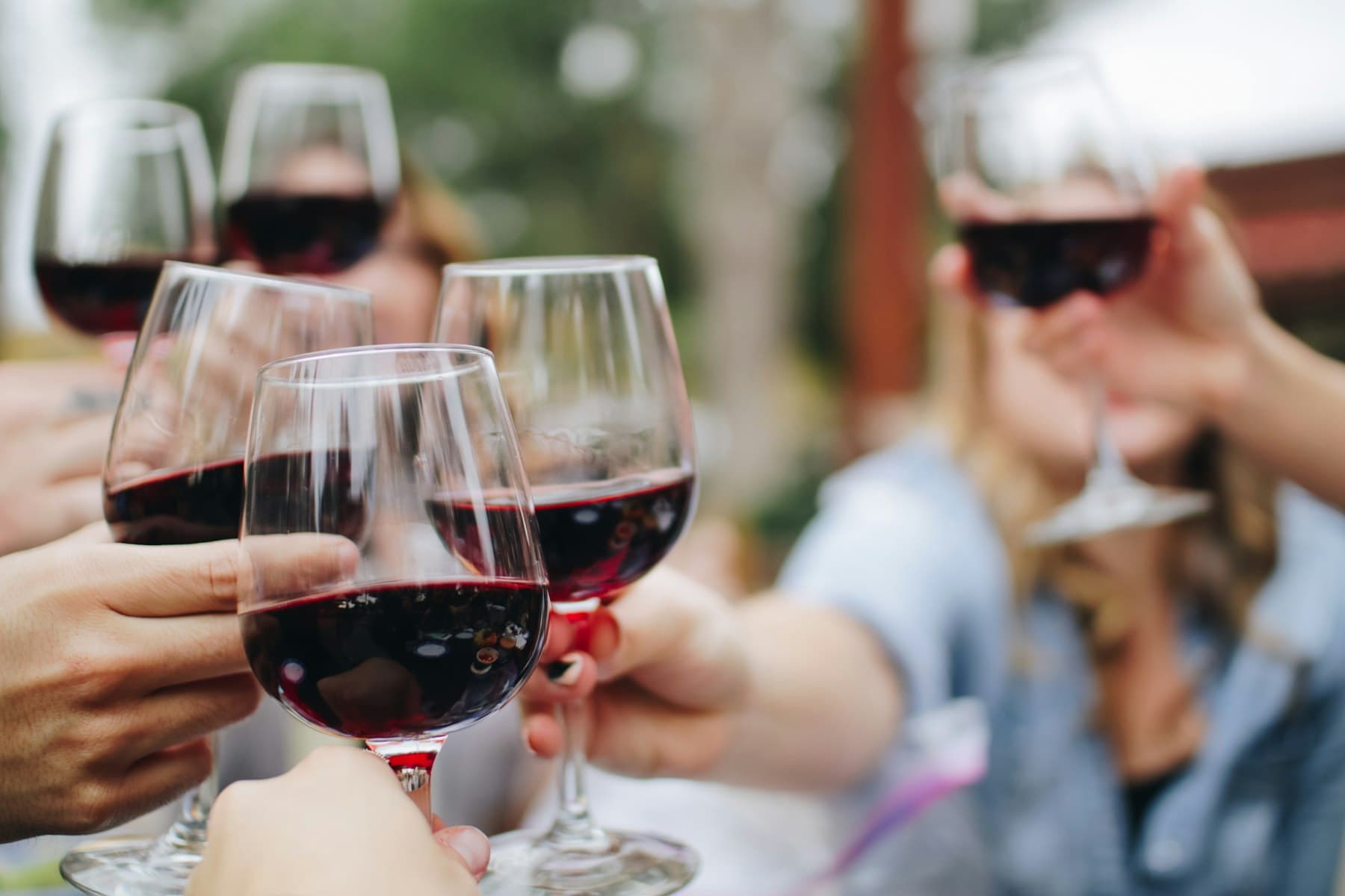 Two glasses of natural wine on a marble bar